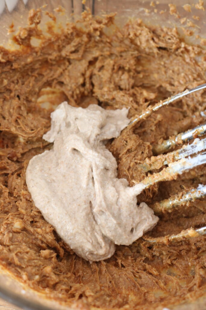 sourdough whole grain molasses cookies batter with sourdough starter on top