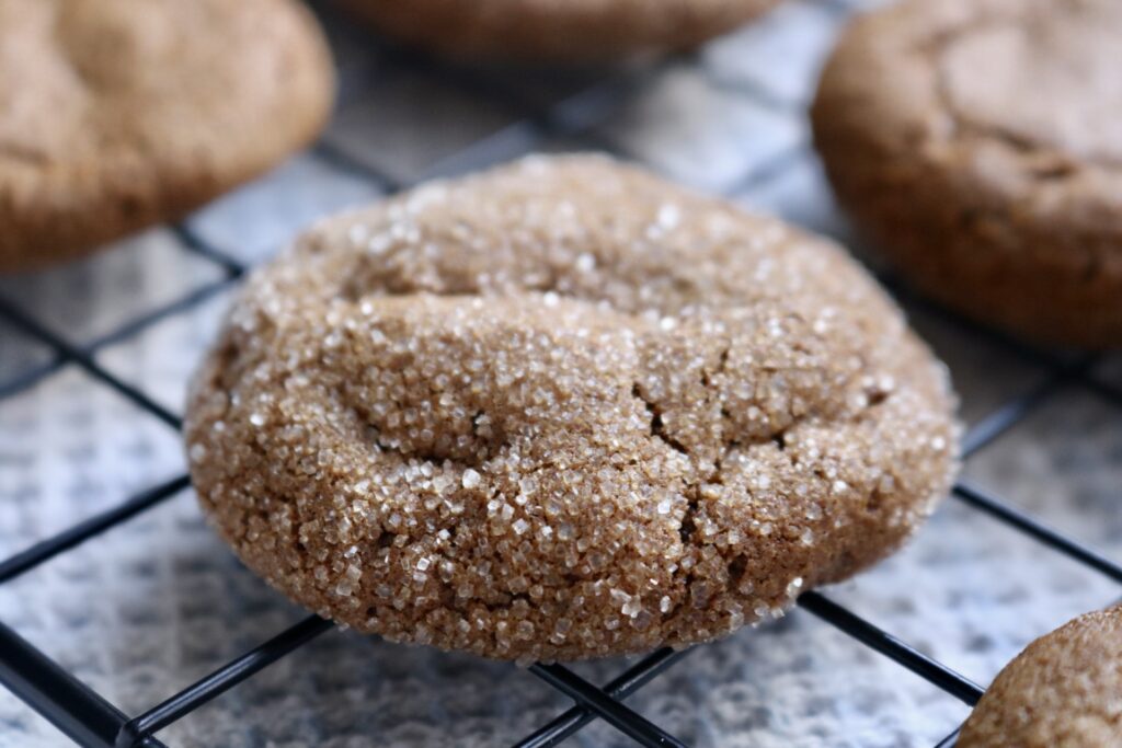 close up of sourdough whole grain molasses cookie on cooling rack