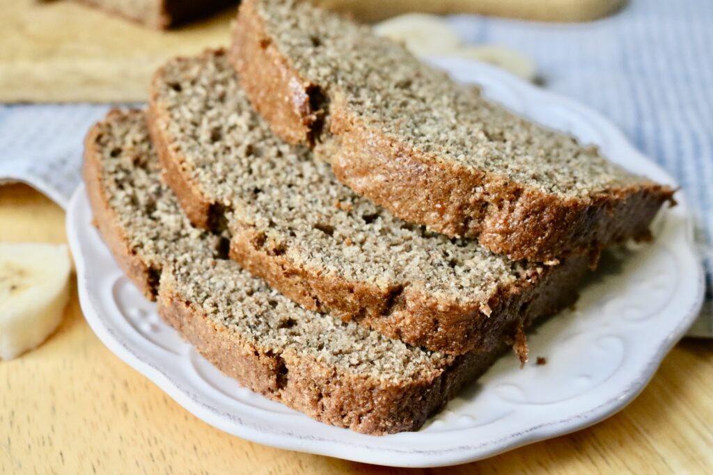 3 slices of sourdough discard banana bread on a white plate