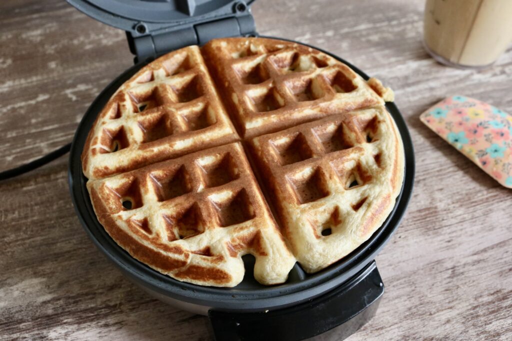 fully cooked waffle on a waffle maker